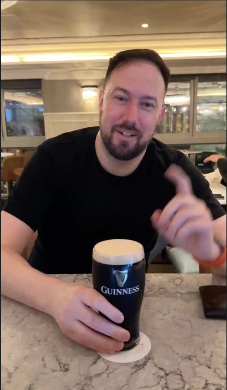 Oliver Locke with a pint of Guinness